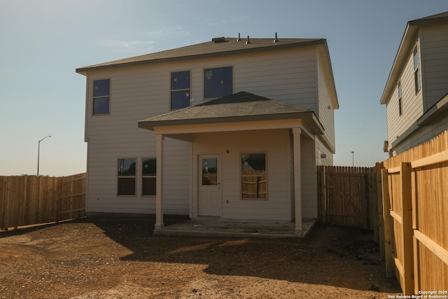 1522 Silver Run, New Braunfels, TX 78130 - back of house with a fenced backyard and a shingled roof