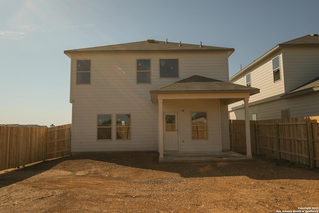 1522 Silver Run, New Braunfels, TX 78130 - back of property with a fenced backyard and roof with shingles