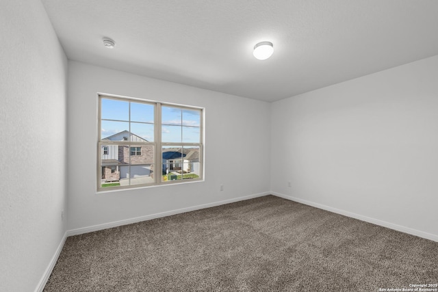 1522 Silver Run, New Braunfels, TX 78130 - carpeted empty room featuring a smoke detector and baseboards