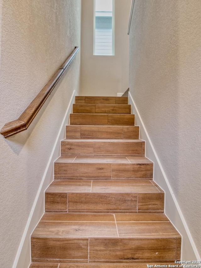 stairs with a textured wall