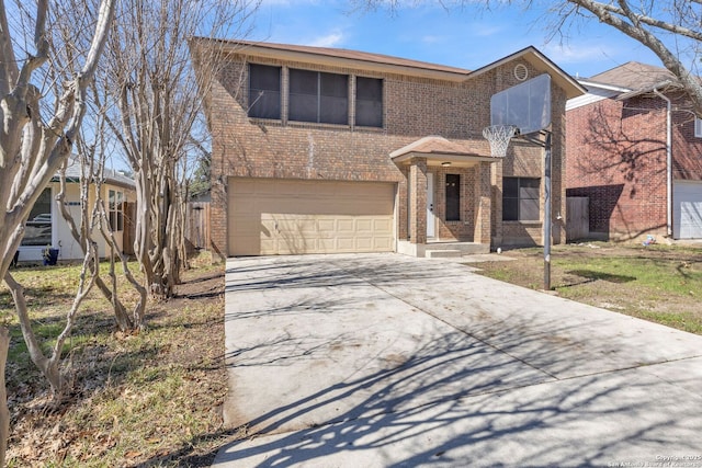 traditional-style home featuring concrete driveway, brick siding, and an attached garage