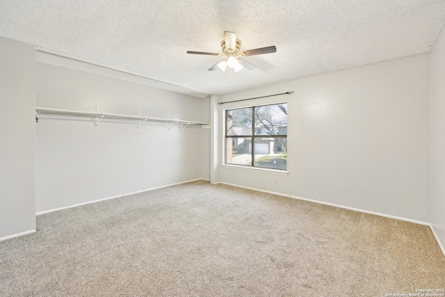 unfurnished bedroom with carpet floors, a closet, and baseboards