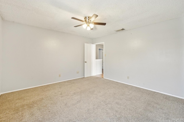 unfurnished room featuring a ceiling fan, a textured ceiling, visible vents, and carpet flooring