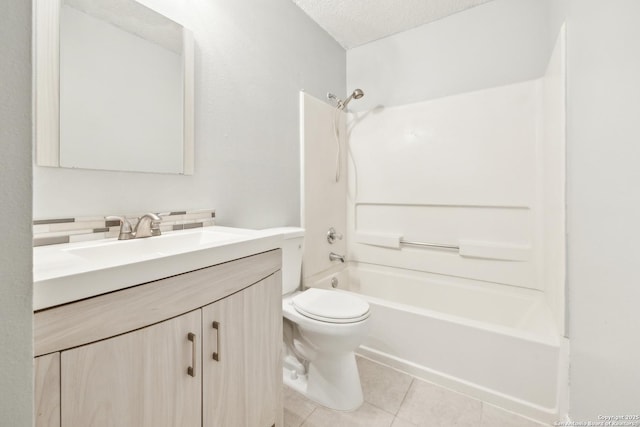 full bath featuring shower / bath combination, toilet, a textured ceiling, vanity, and tile patterned floors