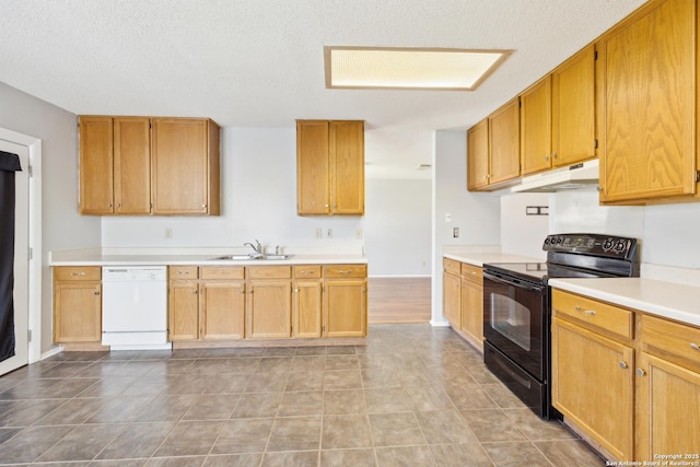 kitchen with light countertops, a sink, dishwasher, under cabinet range hood, and black / electric stove