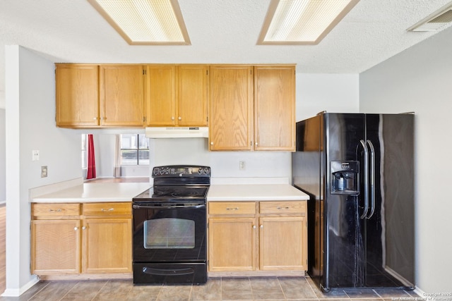 kitchen featuring visible vents, under cabinet range hood, light countertops, a textured ceiling, and black appliances