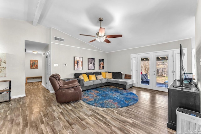 living area with visible vents, lofted ceiling with beams, ceiling fan, wood finished floors, and french doors