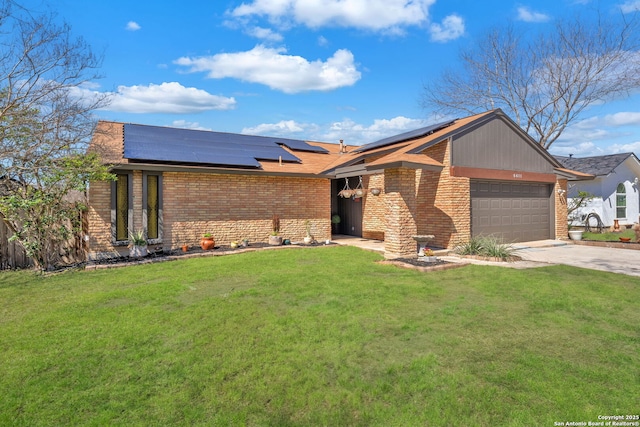 mid-century modern home with concrete driveway, brick siding, an attached garage, and a front lawn