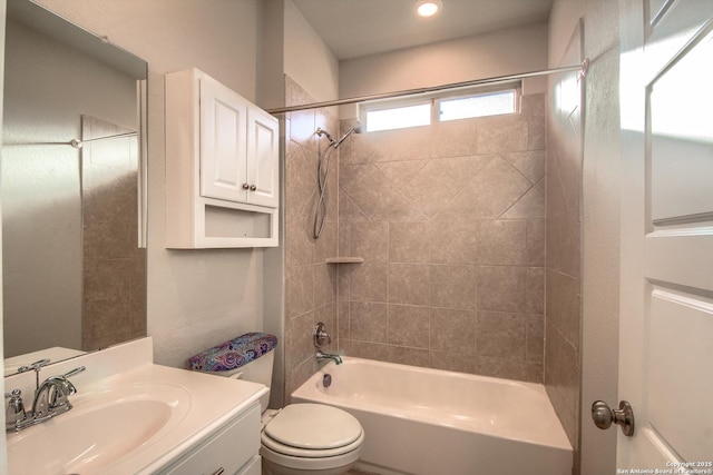 bathroom featuring toilet, shower / tub combination, and vanity