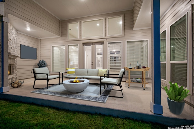 sunroom with a stone fireplace