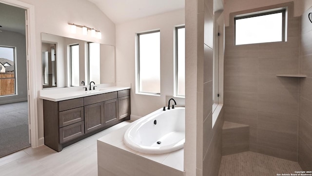 5759 Ryder Rd, New Braunfels, TX 78130 - bathroom with a garden tub, vanity, lofted ceiling, tile patterned flooring, and tiled shower