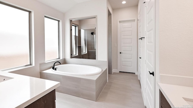 5759 Ryder Rd, New Braunfels, TX 78130 - full bathroom with vanity, a garden tub, tile patterned flooring, and recessed lighting