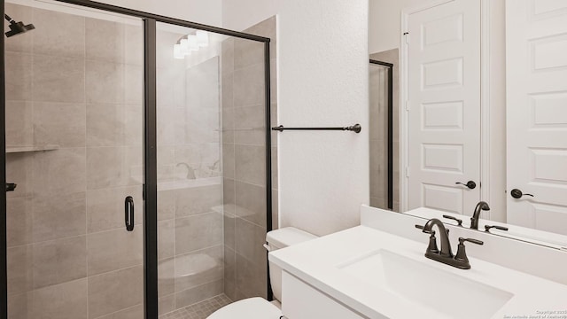5759 Ryder Rd, New Braunfels, TX 78130 - full bathroom featuring vanity, toilet, a stall shower, and a textured wall