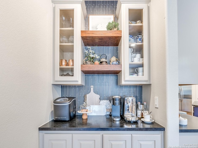 bar featuring freestanding refrigerator