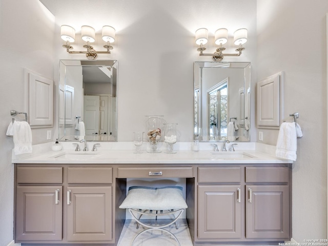 full bathroom featuring double vanity and a sink