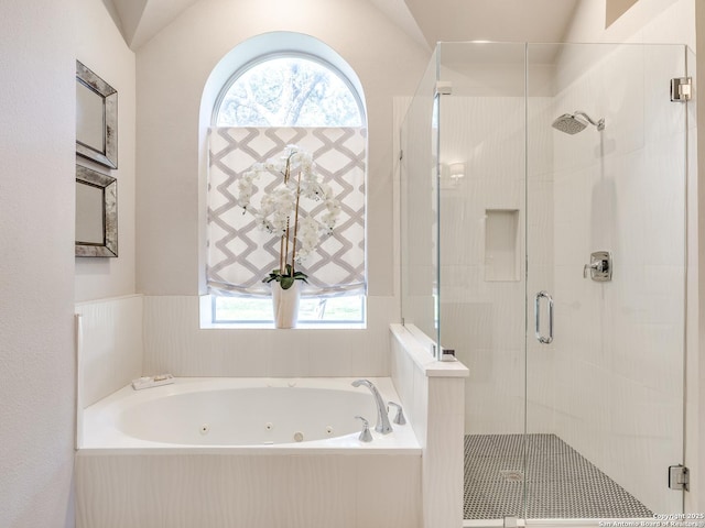 full bath featuring a whirlpool tub and a stall shower