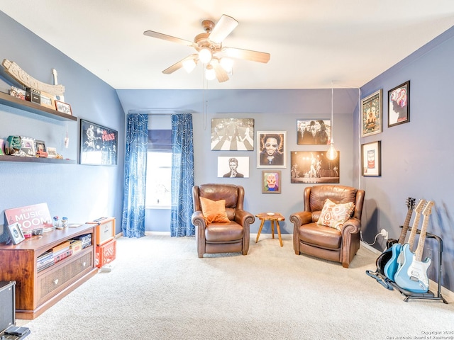 sitting room featuring ceiling fan, carpet flooring, and baseboards