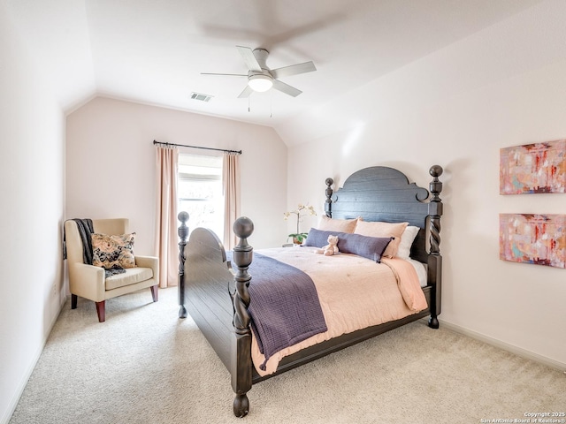 bedroom with baseboards, visible vents, a ceiling fan, light colored carpet, and vaulted ceiling