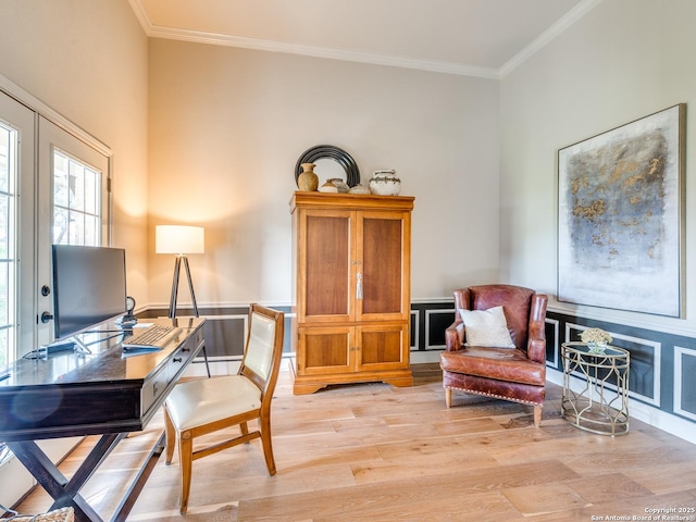 home office with crown molding and light wood-style floors