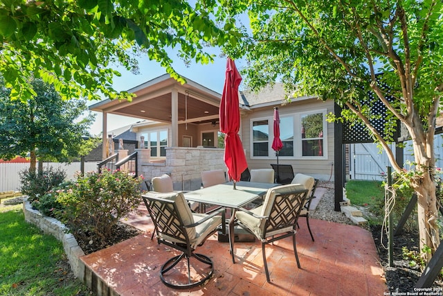 view of patio / terrace featuring outdoor dining space and a fenced backyard