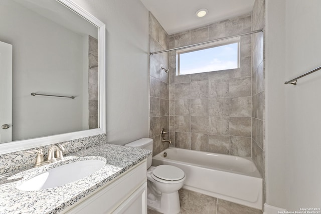 full bath with toilet, tile patterned floors, vanity, and bathing tub / shower combination