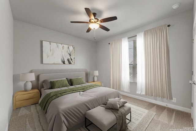 bedroom featuring ceiling fan, carpet floors, and baseboards