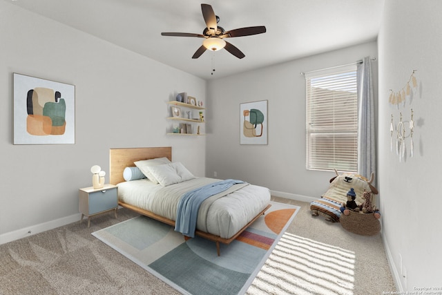 bedroom with carpet floors, ceiling fan, and baseboards