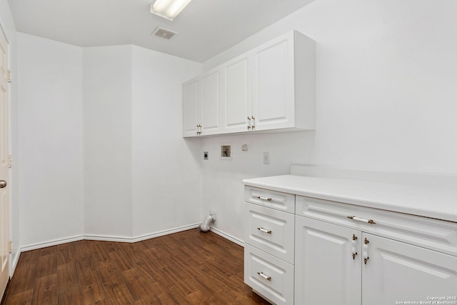 laundry area with hookup for a washing machine, cabinet space, visible vents, dark wood-type flooring, and hookup for an electric dryer