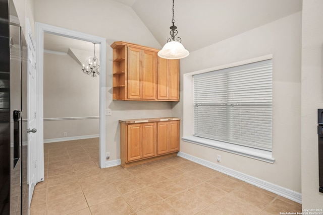 kitchen featuring lofted ceiling, hanging light fixtures, baseboards, and open shelves