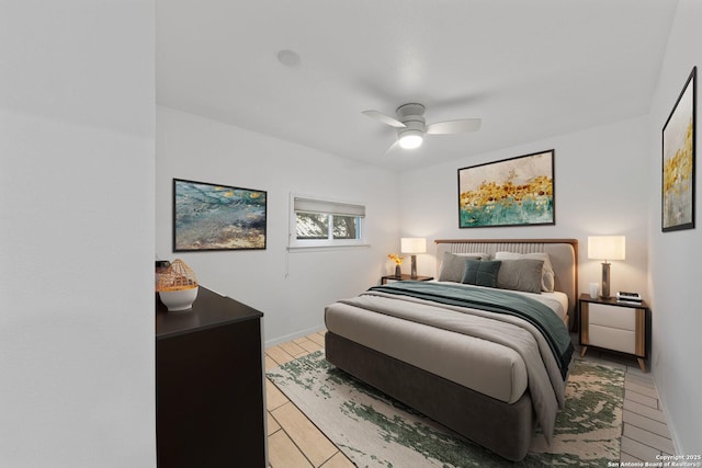 bedroom featuring light wood-type flooring and a ceiling fan