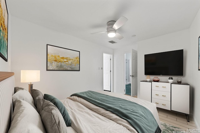 bedroom with a ceiling fan and visible vents