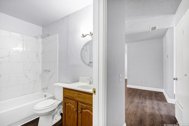 full bath with toilet, visible vents, a textured ceiling, and wood finished floors