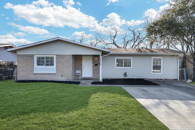 single story home featuring concrete driveway, brick siding, a front yard, and fence