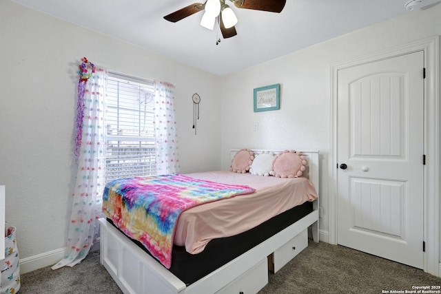 bedroom featuring carpet floors, baseboards, and a ceiling fan