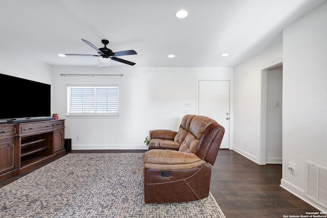 living room with recessed lighting, a ceiling fan, visible vents, baseboards, and dark wood finished floors