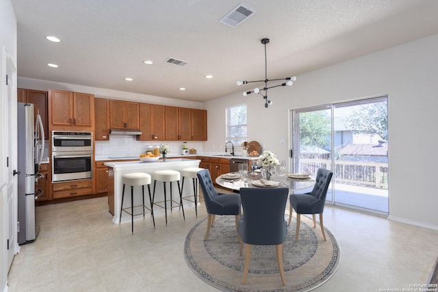 dining room featuring recessed lighting, visible vents, and light floors