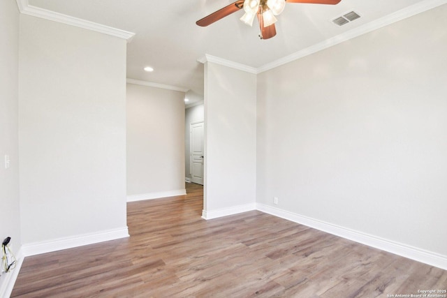 unfurnished room with recessed lighting, visible vents, ornamental molding, wood finished floors, and baseboards