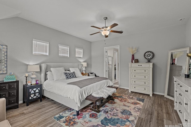 bedroom featuring light wood-style floors, ceiling fan, and baseboards