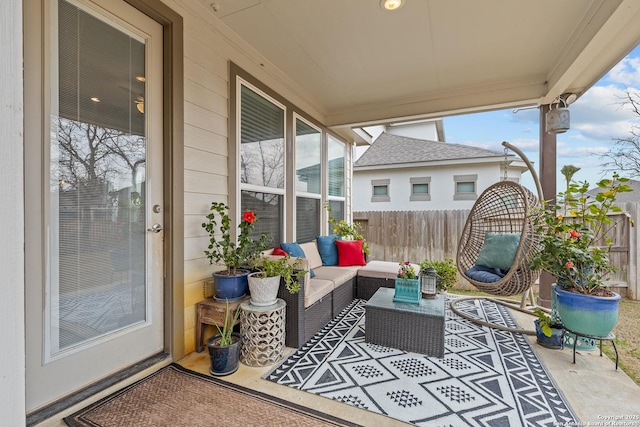 view of patio with fence and an outdoor hangout area