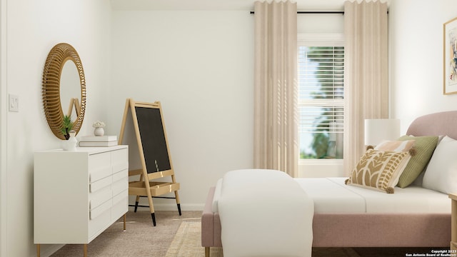 bedroom featuring carpet flooring and baseboards