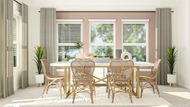 dining area with wood finished floors and baseboards