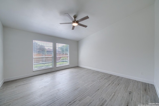 unfurnished room featuring light wood finished floors, ceiling fan, and baseboards