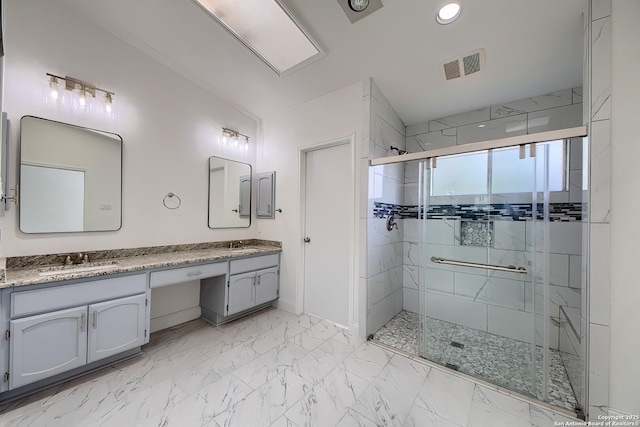 full bath featuring a sink, visible vents, marble finish floor, a shower stall, and double vanity