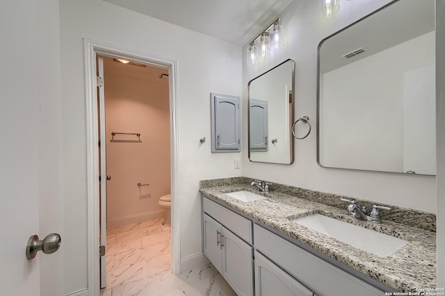 full bathroom featuring marble finish floor, baseboards, visible vents, and a sink