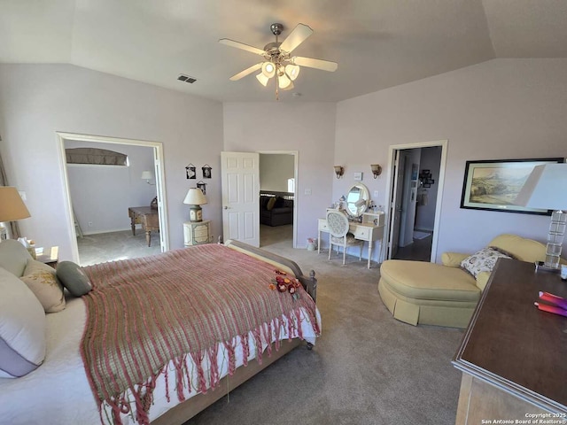 bedroom with a closet, carpet flooring, vaulted ceiling, and a spacious closet