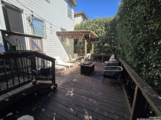 wooden deck featuring a pergola