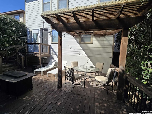 wooden terrace featuring outdoor dining space and a pergola