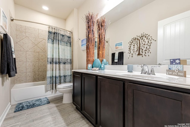 full bathroom featuring shower / tub combo with curtain, vanity, toilet, and wood finished floors