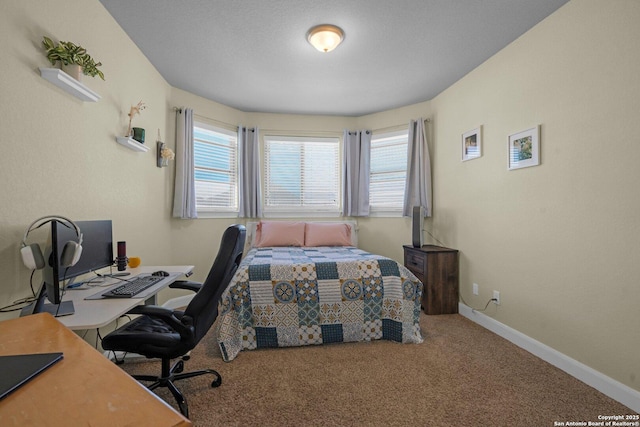 carpeted bedroom with baseboards