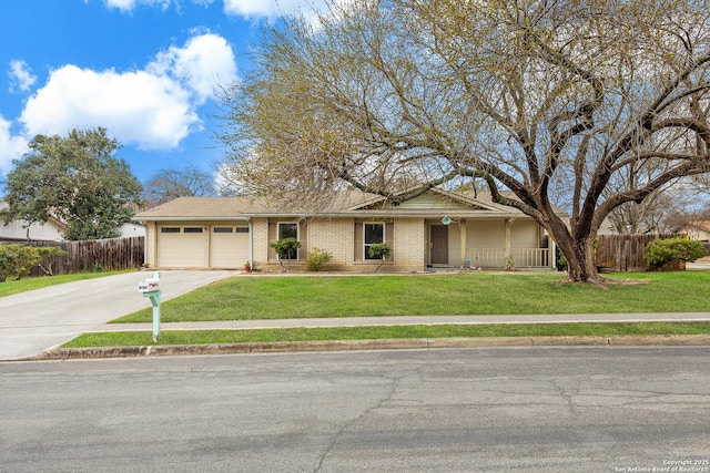 ranch-style house featuring brick siding, fence, a garage, driveway, and a front lawn